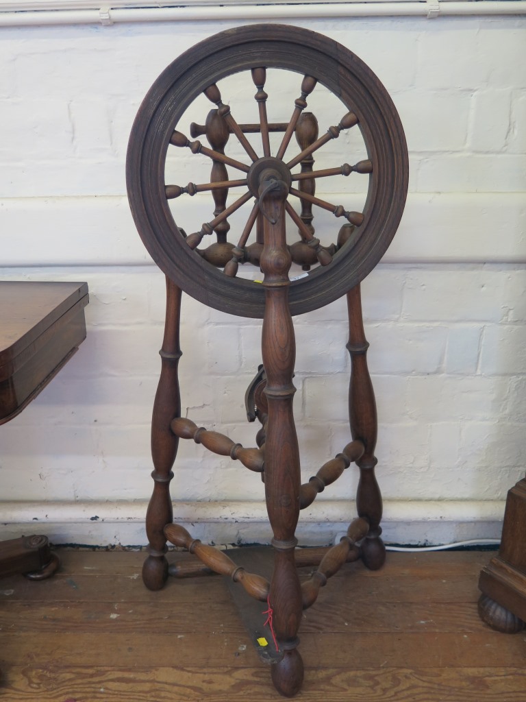 An unusual Saxony design spinning wheel, with turned supports 117cm high