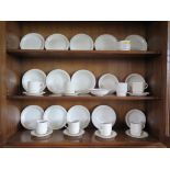 A Poole Pottery beige part breakfast service, plain with fluted border (32 pieces)
