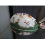 A Dresden box in the form of an egg, with floral painted decoration and green scale border, 18cm