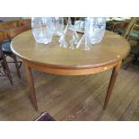 A G-Plan teak dining table and six chairs, the table with fitted leaf, 121cm wide, the chairs with