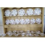 A Royal Albert 'Moss Rose' pattern part breakfast service, including plates, bowls, teacups and