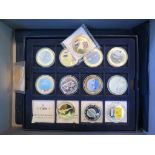 A small collection of Concorde memorabilia to include coins, signed photographs of the pilot, etc