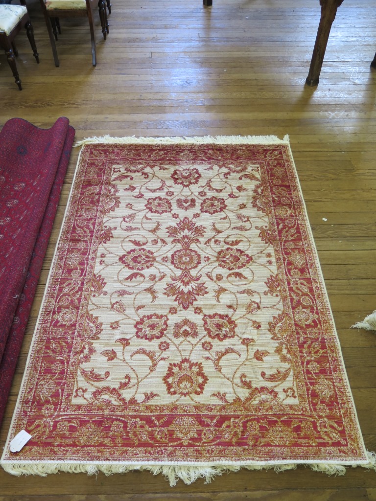 *A Zeigler style rug, with red palmettes within a red border 190cm x 134cm