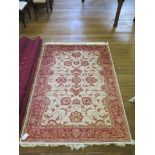*A Zeigler style rug, with red palmettes within a red border 190cm x 134cm