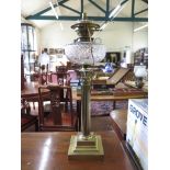 A brass Corinthian column style oil lamp, with etched glass shade, converted to electricity 68cm
