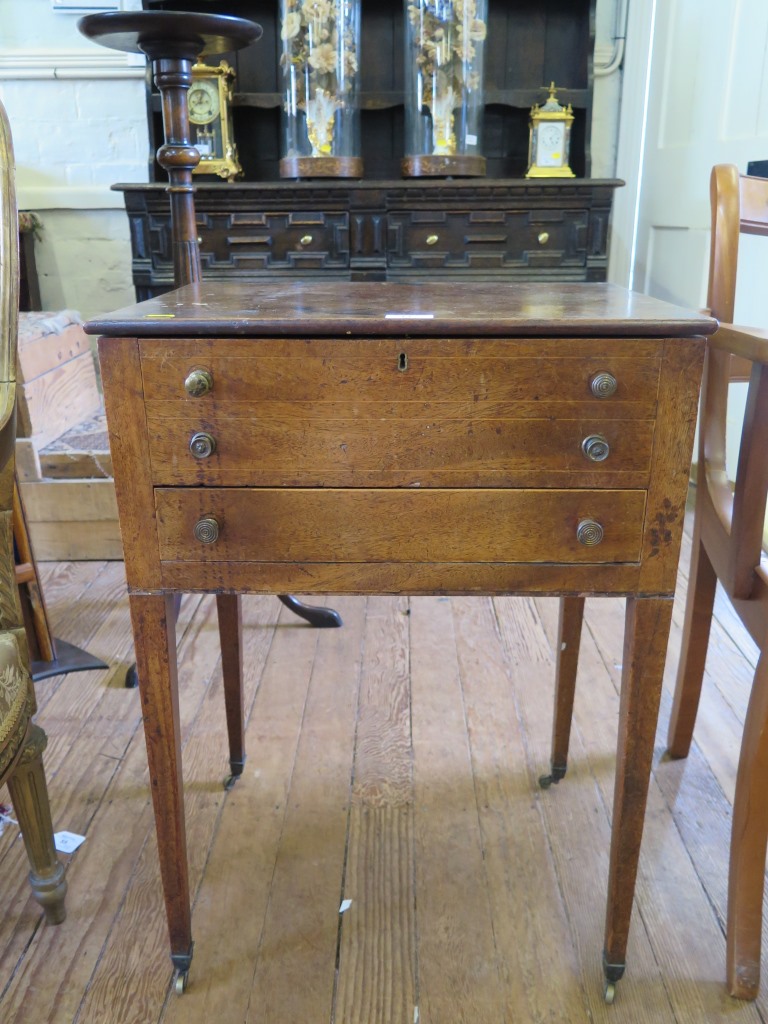 A 19th century mahogany side table, the hinged lid over two dummy drawers and a long drawer on