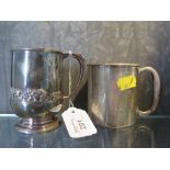 A child's christening silver mug decorated with bears in relief, together with a silver plated mug