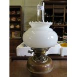 A brass oil lamp, with opaque glass shade 43cm high