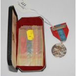 A cased Elizabeth II Imperial Service medal