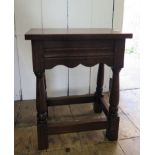 An 18th century style oak stool, with moulded frieze and turned legs, stamped 'Made by W.V.