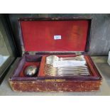 A Victorian continental box with six knives, six spoons, six forks a carving set and a large