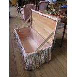 An upholstered pine blanket box, with padded lid 108cm wide, 46cm deep, 42cm high