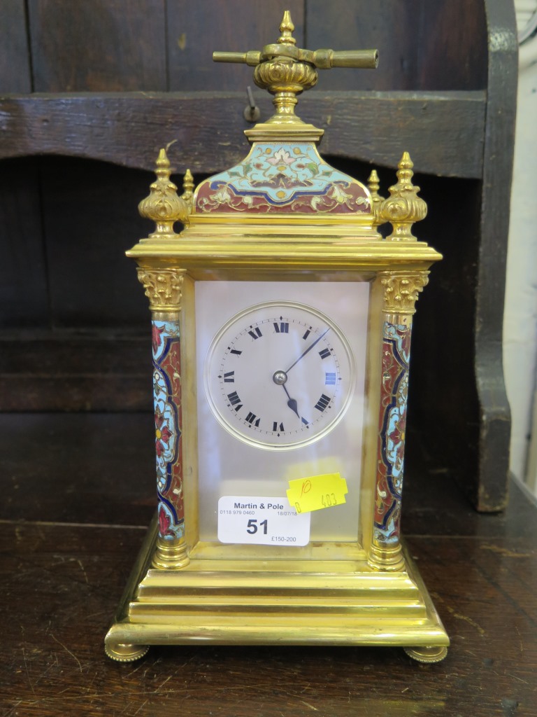 An Edwardian brass and champsleve enamel mantel clock, the caddy top and finials over a silvered