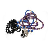 A collection of necklaces to include amethyst lapis and black onyx