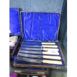 A cased carving set, a pair of fish servers and a boxed set of tea knives
