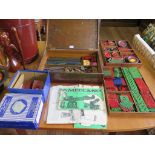 Meccano: Selection of pre-war and early post-war red and green parts including strips, plates, rods,