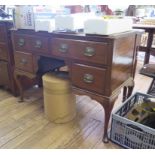 A mahogany lady's writing table, with two drawers over a kneehole flanked by short drawers on