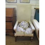 A 17th century style walnut barley-twist arm chair, with high upholstered back, stuff-over seat