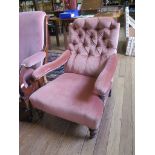 A Late Victorian walnut armchair, the button upholstered back above open arms on turned tapering