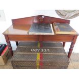 A Victorian mahogany serving table, the triangular back above a side frieze drawer on ring turned