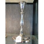 A pair of silver candlesticks on stepped base, 27cm high, London 1942