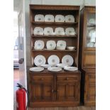 A pair of Ercol dark oak bookcase cabinet, each with open shelves over two short drawers and