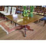 An early 19th century mahogany snaptop breakfast table, the rectangular top on a turned column