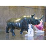 A carved green verdite stone model of a standing rhino, 23cm long