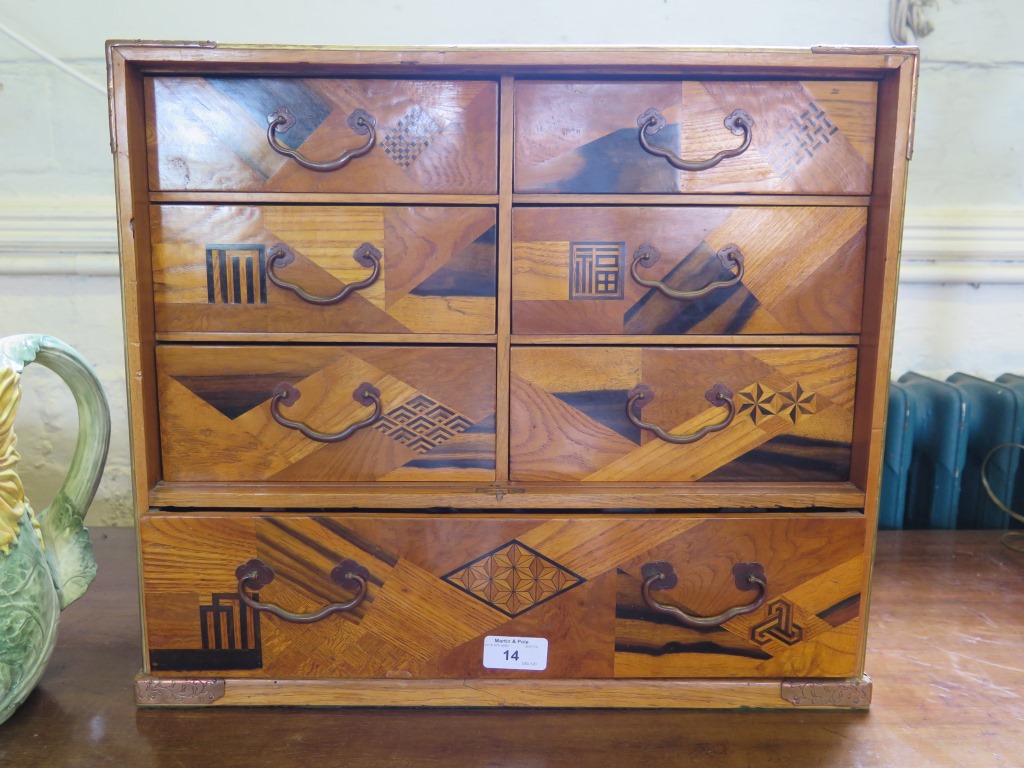 A Japanese inlaid parquetry table cabinet, with six drawers over a long drawer 45cm wide, 27cm deep,
