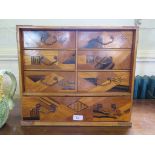 A Japanese inlaid parquetry table cabinet, with six drawers over a long drawer 45cm wide, 27cm deep,