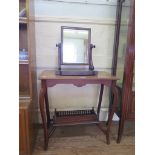 An Edwardian mahogany window table with cabriole legs and galleried undershelf, 68cm wide, and a