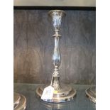 A pair of silver candlesticks on stepped base, 27cm high, London 1942