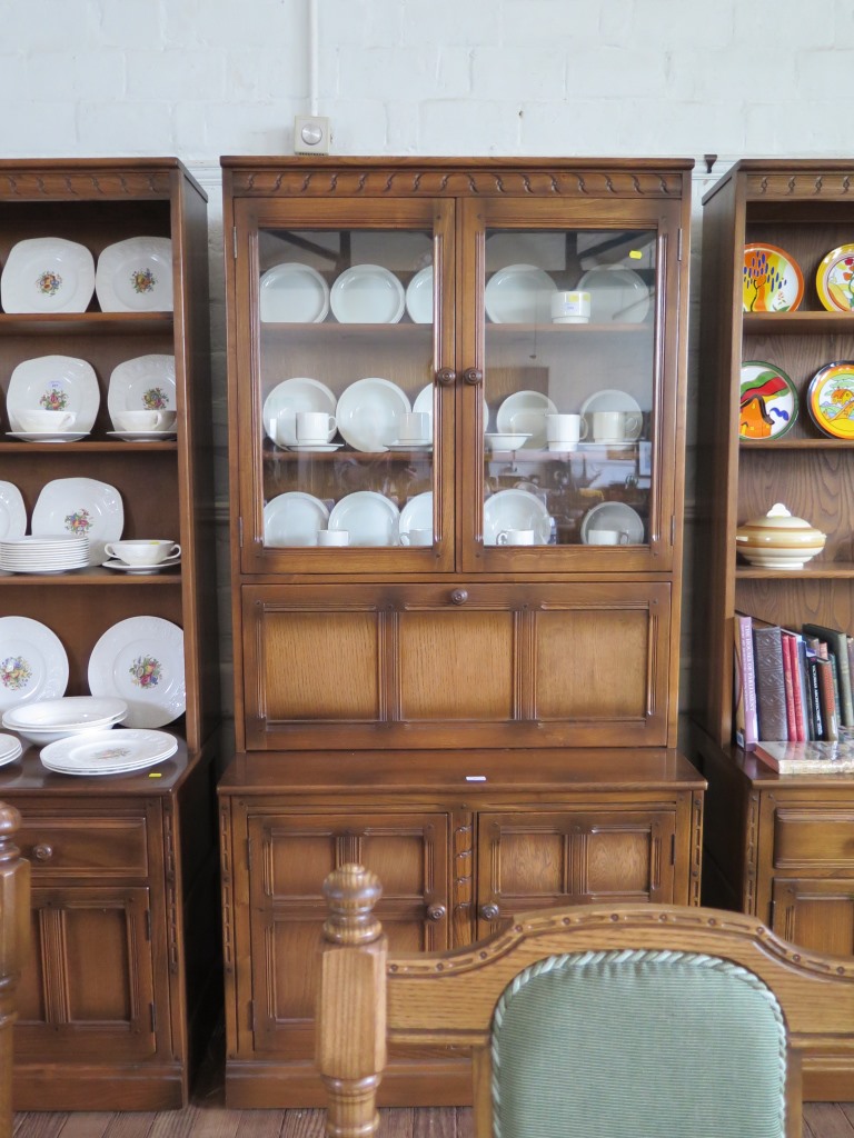 A pair of Ercol dark oak bookcase cabinet, each with open shelves over two short drawers and - Image 2 of 3