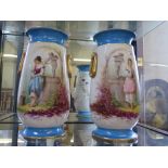 A pair of late 19th century French porcelain vases, with Sevres blue bands and painted with girls