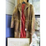 A three quarter length fur coat