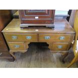 A mahogany lady's writing table, with two drawers over a kneehole flanked by short drawers on