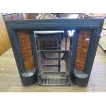 A Victorian cast iron fire surround with brown glaze tiles and half shelves 97cm high 96.5cm wide