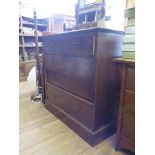 An oak chest of drawers with two short and three long graduated drawers 107cm wide