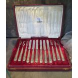 A set of tea knives and forks with silver handles for six place settings in presentation case