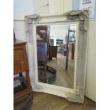 An ornate painted frame wall mirror with bevelled rectangular plate 88cm x 119cm