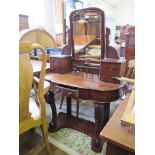 A Victorian mahogany dressing table, the swing plate with four trinket drawers over a shaped