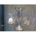 A silver eperne vase having three silver sweetmeat dishes suspended from the vase, marks rubbed