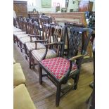 Two George III elm carver dining chairs, with pierced vase shape splats and square legs joined by