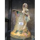 An Ernest Wahliss Secessionist style wine jug, the handle in the form of a lady holding grapes and