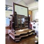 A Victorian mahogany toilet mirror, the rectangular plate on serpentine supports and base on