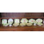A set of Victorian green ground serving plates, side plates and pedestal tureens, each hand