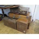 A canvas and wood cabin trunk, and four various suitcases