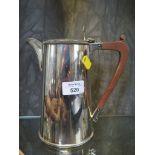 A silver plated water jug