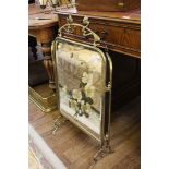 A Victorian Art Nouveau style triptych firescreen with mirrored panels painted with floral designs
