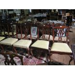 Two pairs of George III style mahogany dining chairs, each with pierced vase shape splats, and